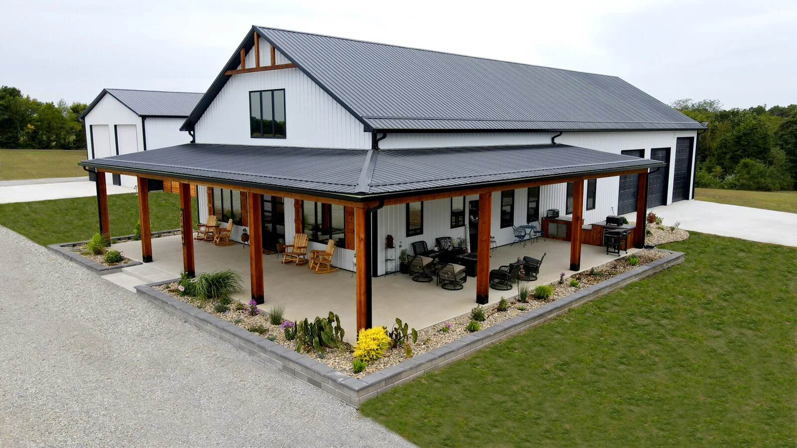 Barndominium with wraparound covered porch